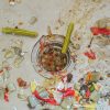 An image of food clogging a garbage disposal.