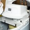 A homeowner performs water softener maintenance.